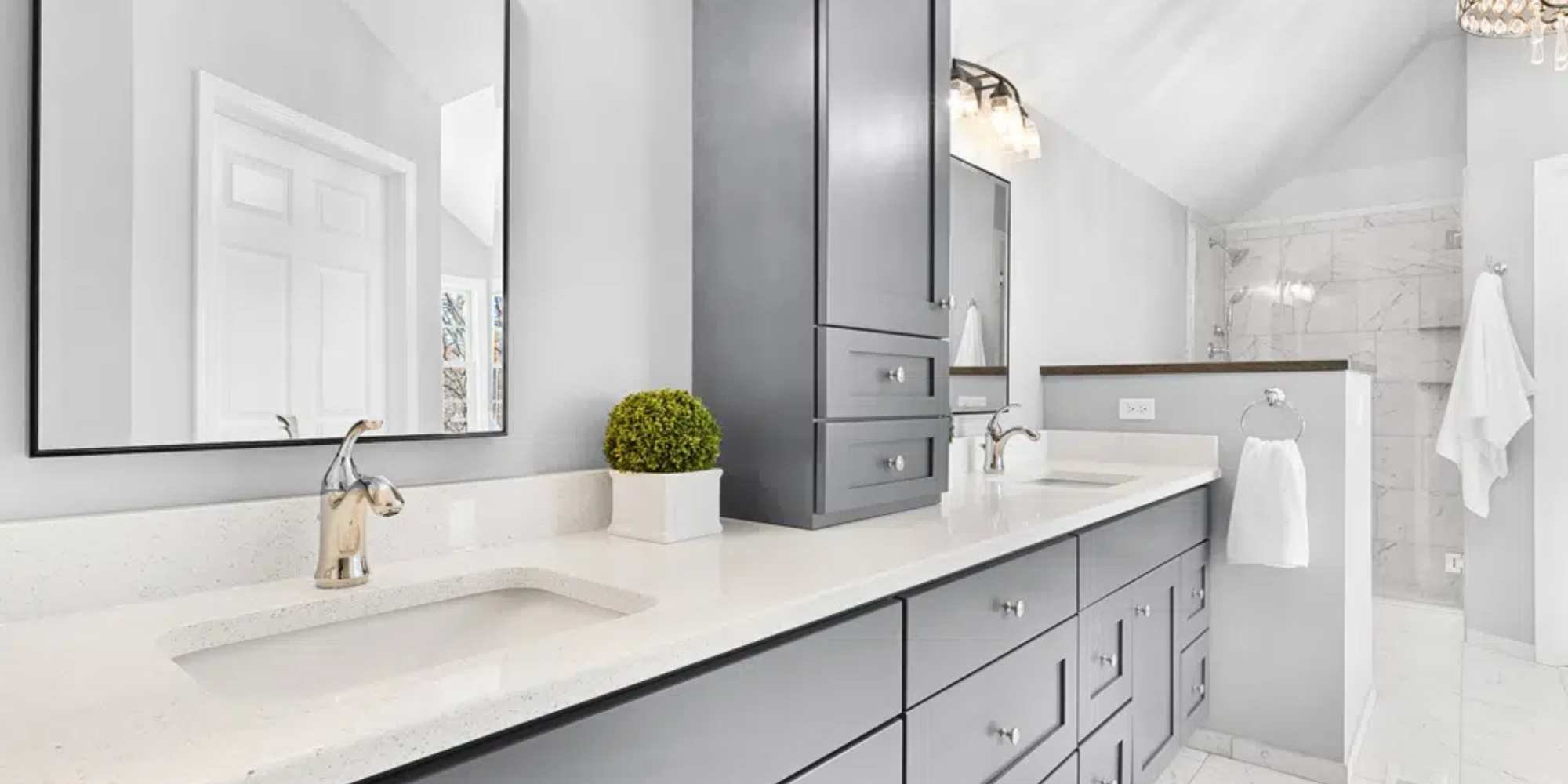Elegant bathroom remodel with double vanity and gray cabinetry by J&J Construction in Naperville