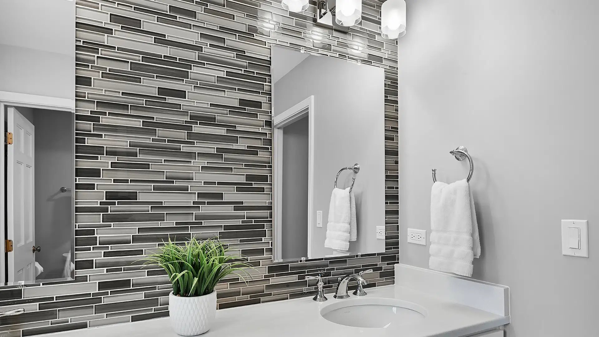 Image of the dual-vanity sink, mirrors, and backsplash installed by J&J Remodeling in Naperville, IL