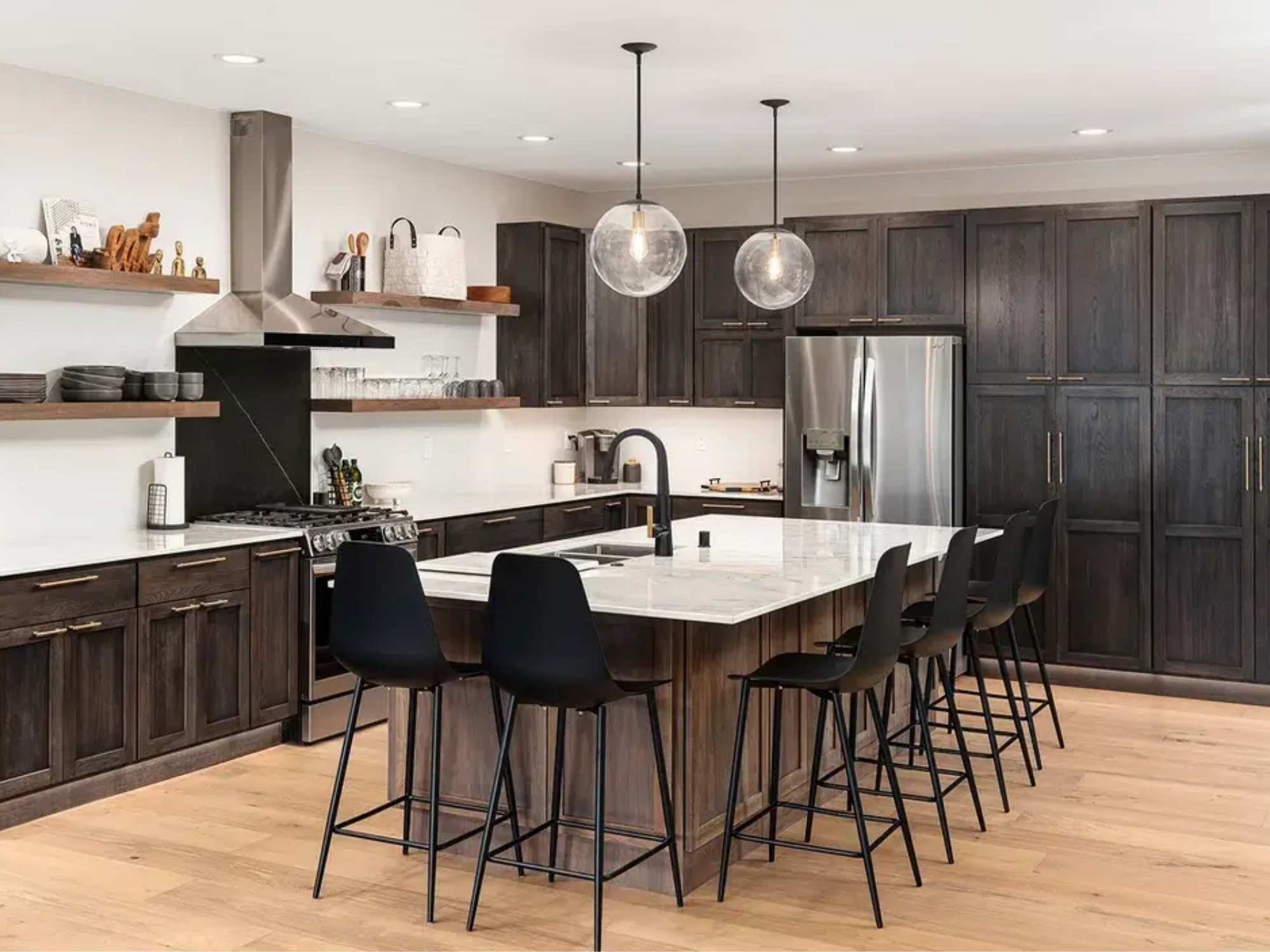 Naperville kitchen remodel with a large island and brown cabinets by J&J Construction