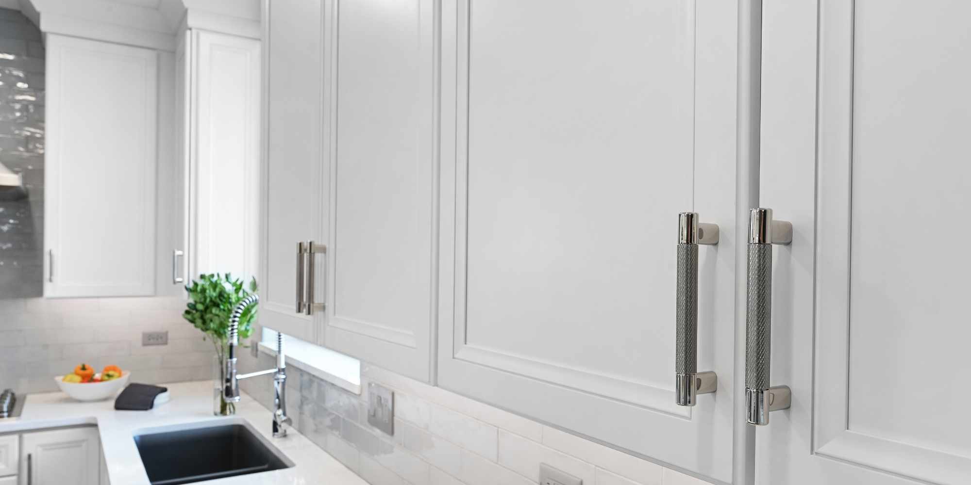Image of remodeled kitchen cabinetry in Aurora, IL by J&J Construction with brushed nickel hardware details