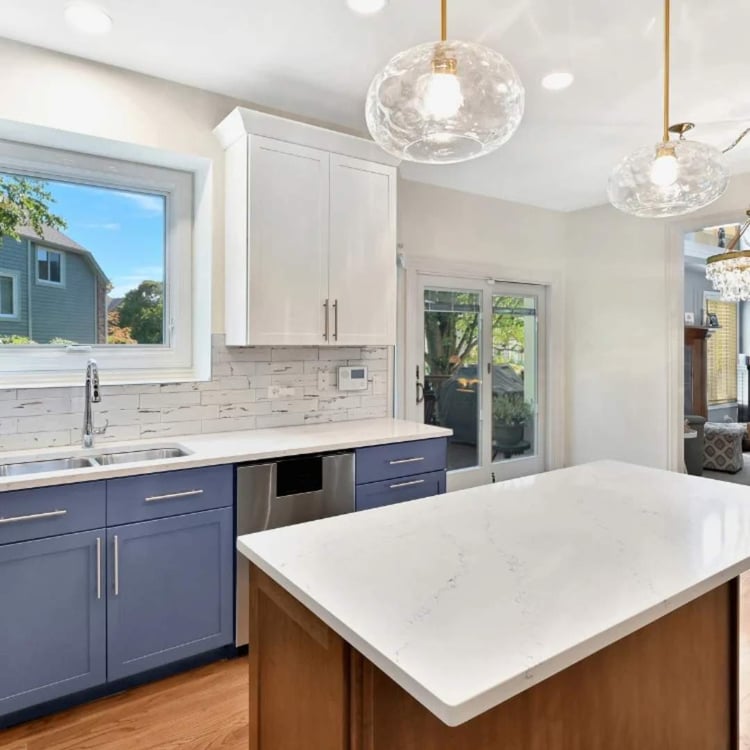 Bright kitchen remodel in Aurora IL with island and pendant lights by J&J Construction