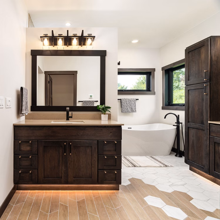 dark wood bathroom vanity with toe kick lighting
