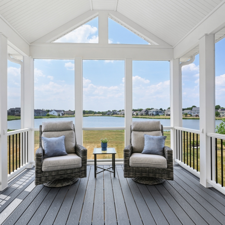 screened porch with a lake view